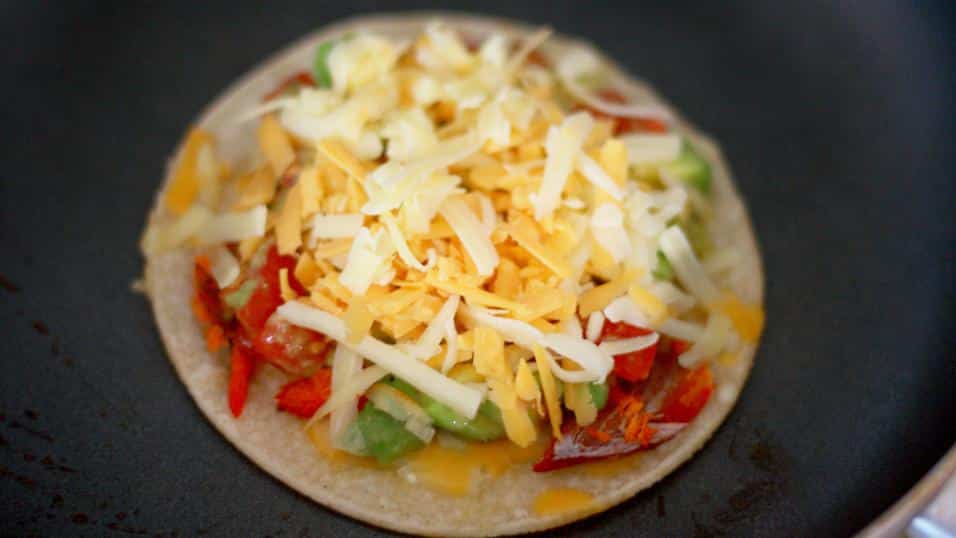adding last layer of cheese