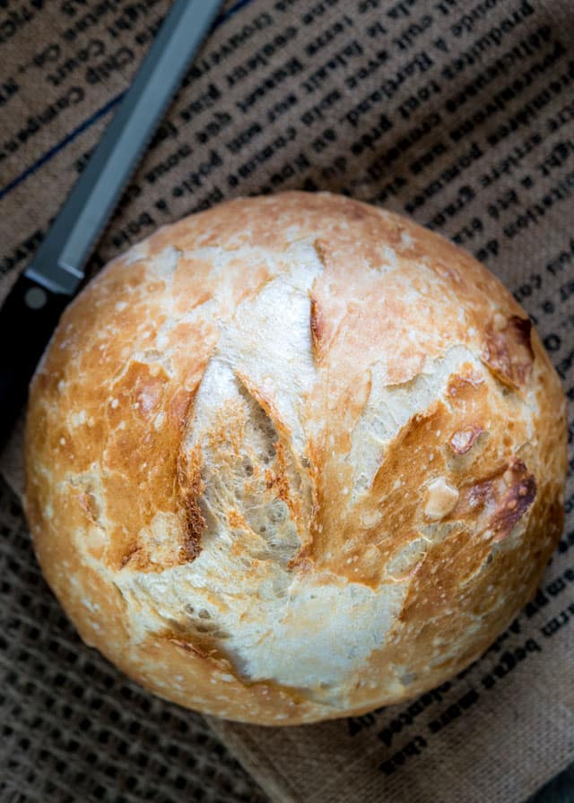 No Knead Dutch Oven Crusty Bread - no kneading required, 4 simple ingredients, baked in a Dutch Oven! The result is simple perfection, hands down the best bread you'll ever eat!