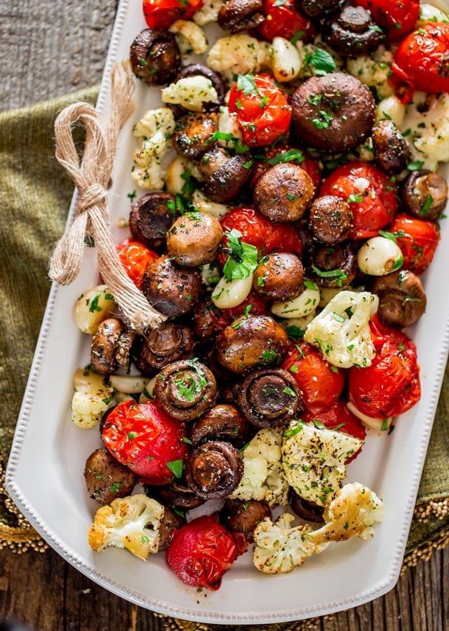 Italian Roasted Mushrooms and Veggies - absolutely the easiest way to roast mushrooms, cauliflower, tomatoes and garlic Italian style. Simple and delicious.