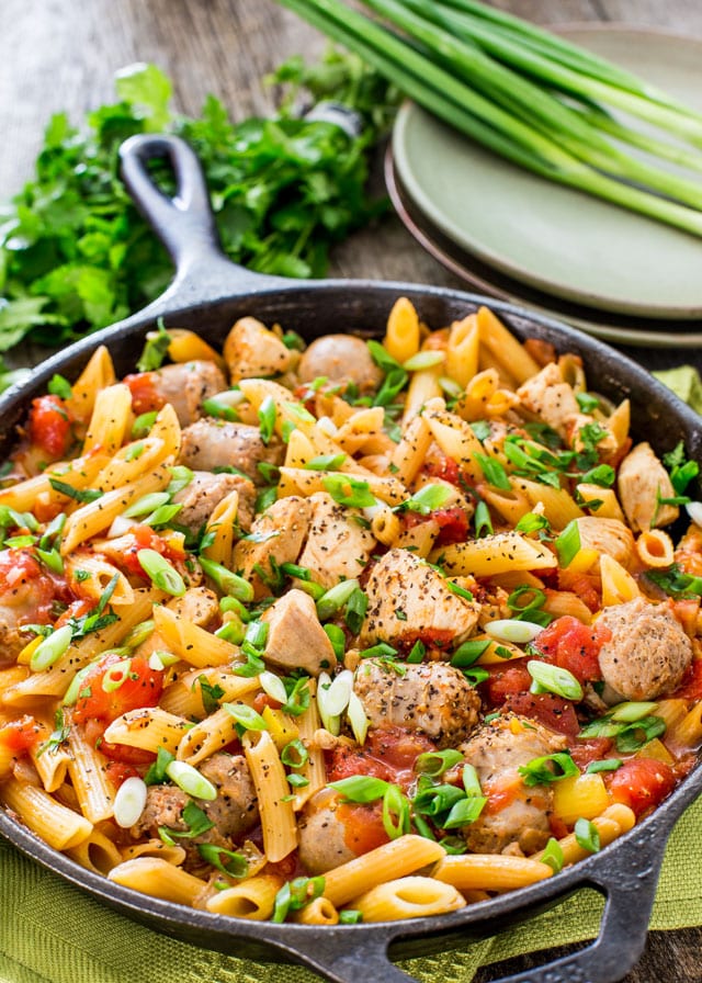 Chicken and Sausage Penne Jambalaya in a black skillet from 30 minute one pot meals cookbook