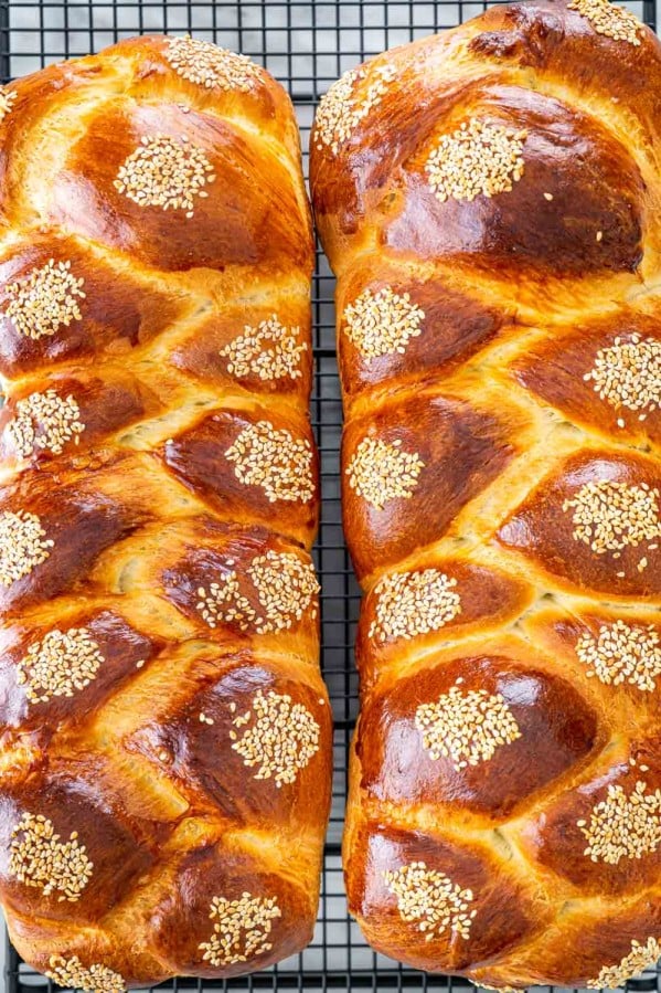 overhead shot of two loaves of braided Easter bread on a cooling rack