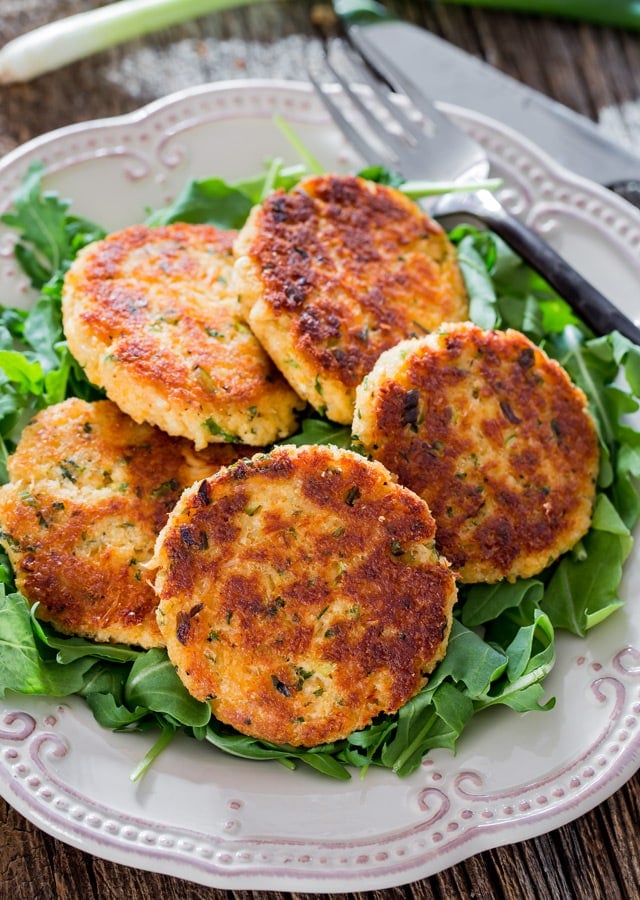 Easy Crab Cakes on a bed of arugula on a white plate