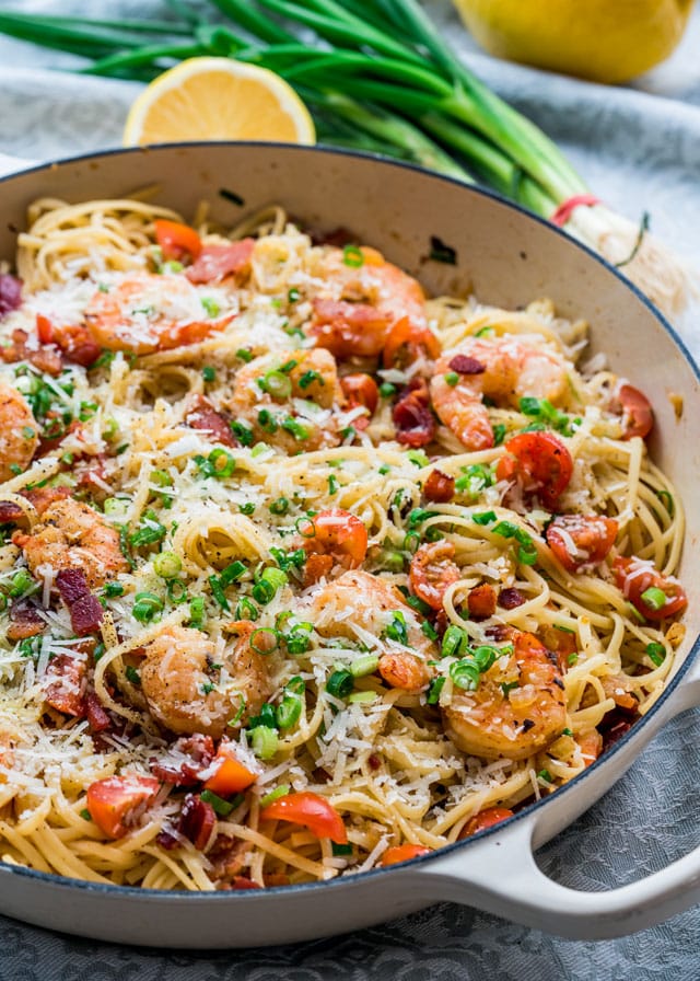 shrimp and bacon scampi topped with scallions and cheese