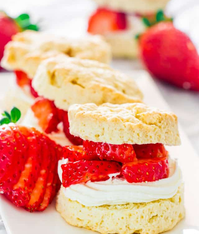 strawberry shortcakes lined up on a plate