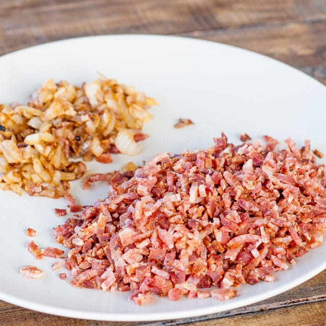 A plate of chopped bacon and fried onion
