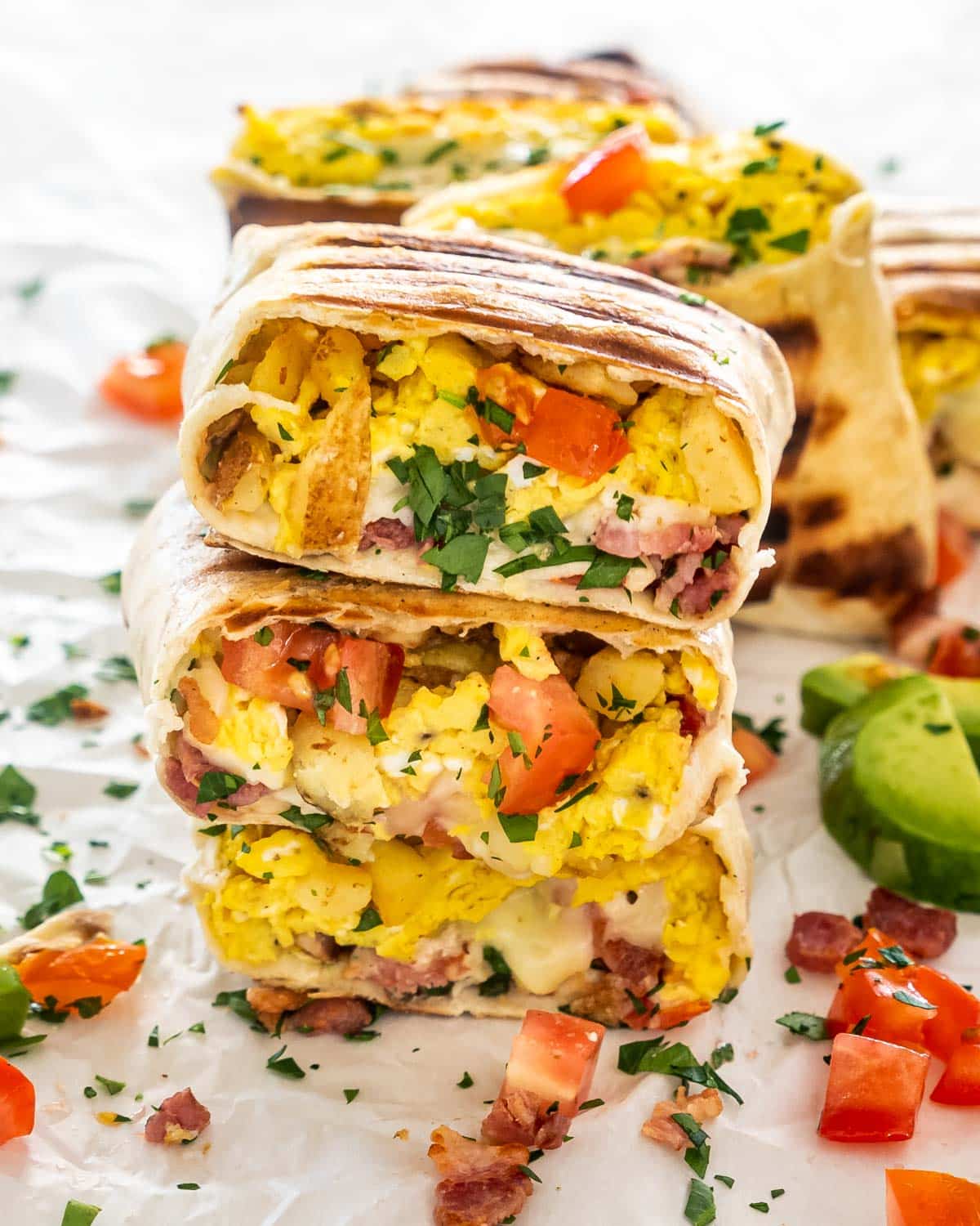 a stack of breakfast burritos.