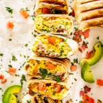 a stack of breakfast burritos.
