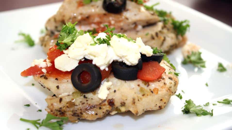 Greek style turkey breast topped with tomato, sliced black olives, crumbled feta cheese and garnished with parsley