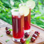 two tall glasses of cherry mojitos