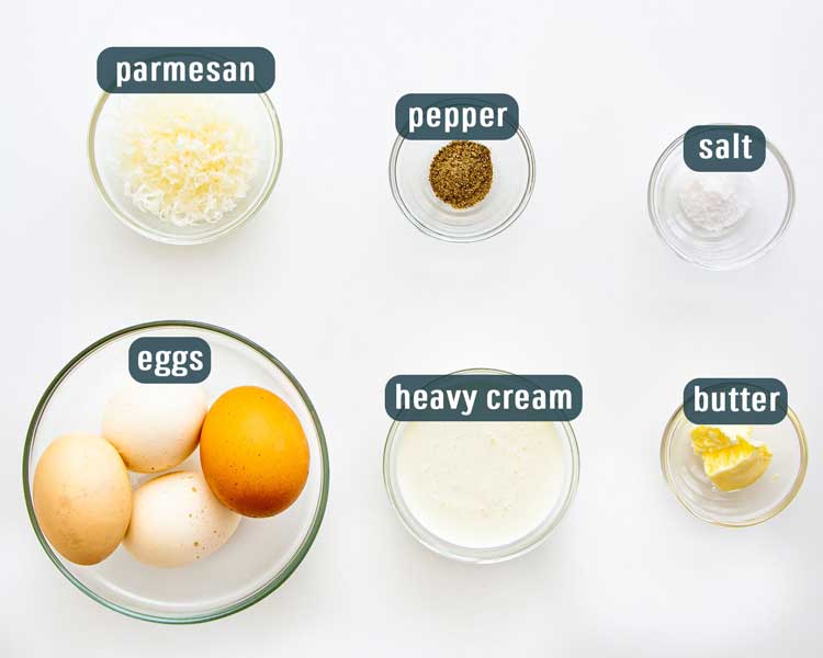 overhead shot of ingredients needed to make creamy parmesan baked eggs