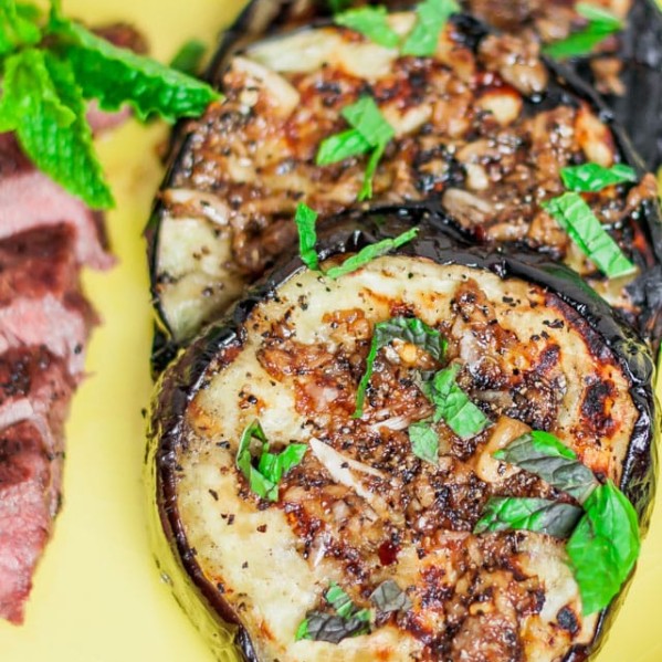 grilled eggplant slices with garlic sauce and mint