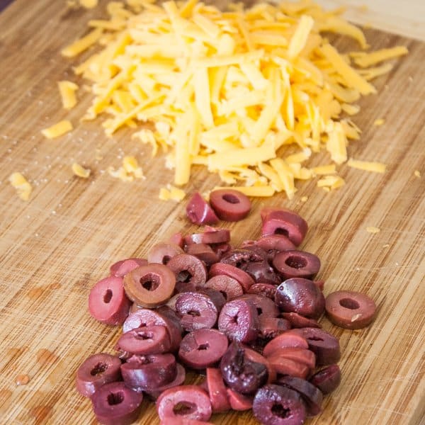 Sliced olives and shredded cheese 