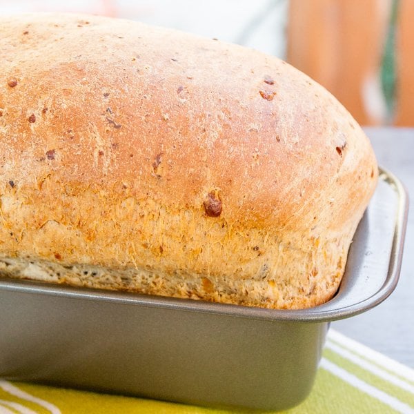 Side shot of bread in loaf pan