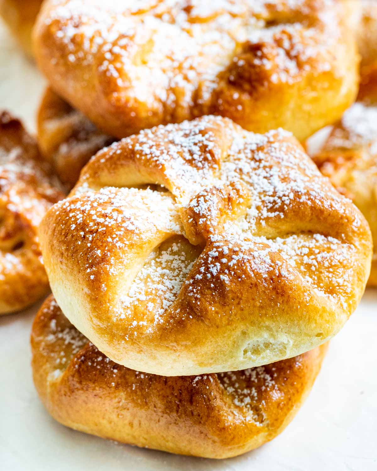 sweet cheese buns stacked on top of each other.
