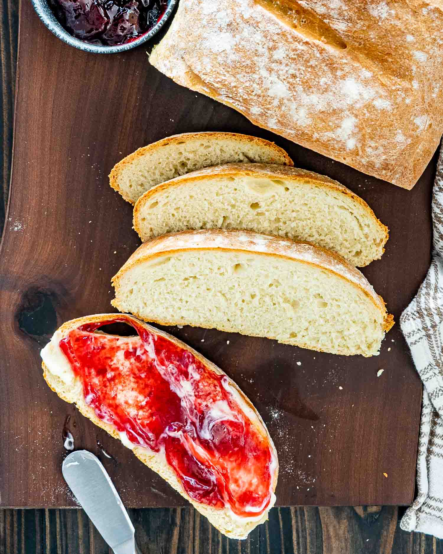 sliced artisan bread on a cutting board.