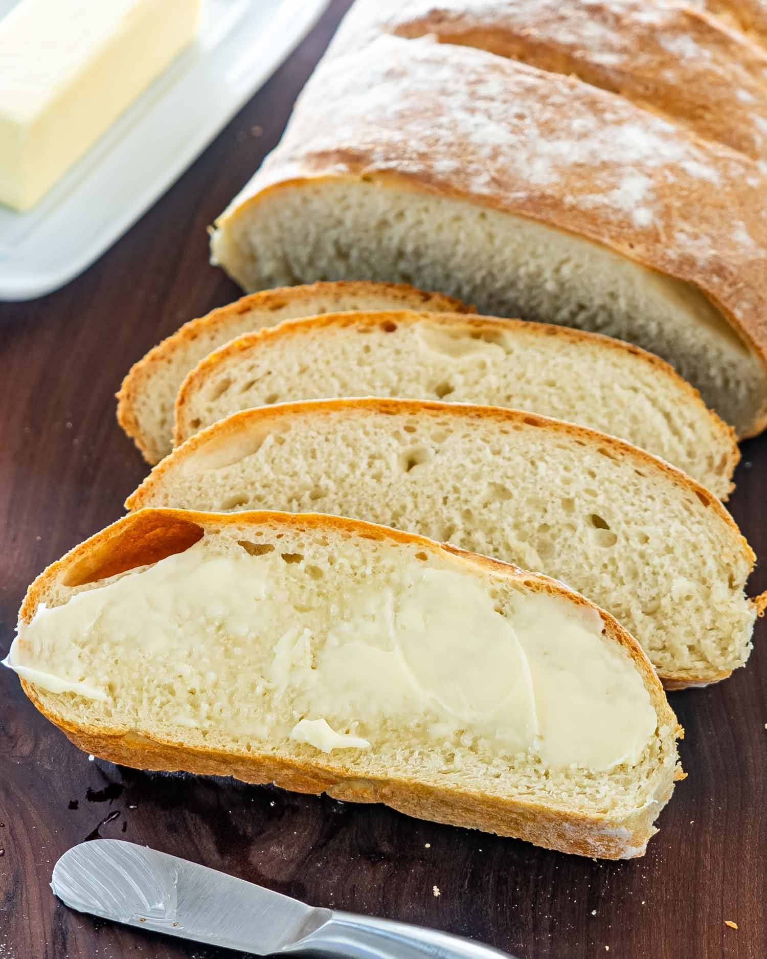 sliced artisan bread on a cutting board.