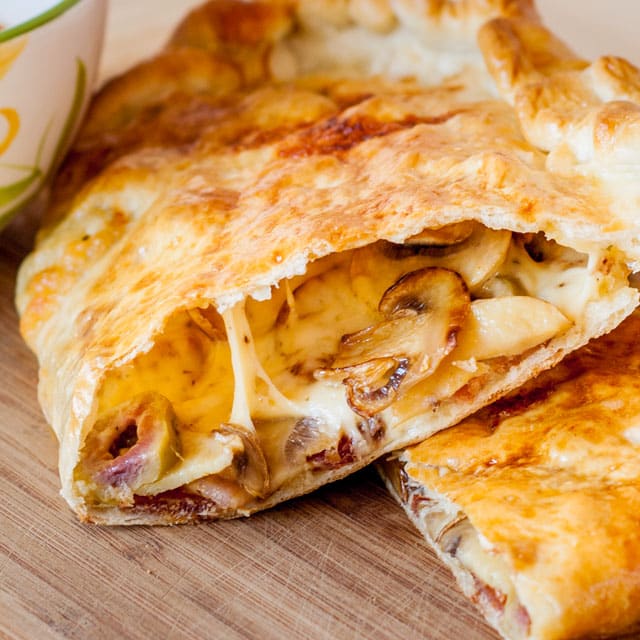 Bacon Mushroom Calzones come packed with cheese, mushrooms, bacon and a secret ingredient that make these calzones phenomenal.