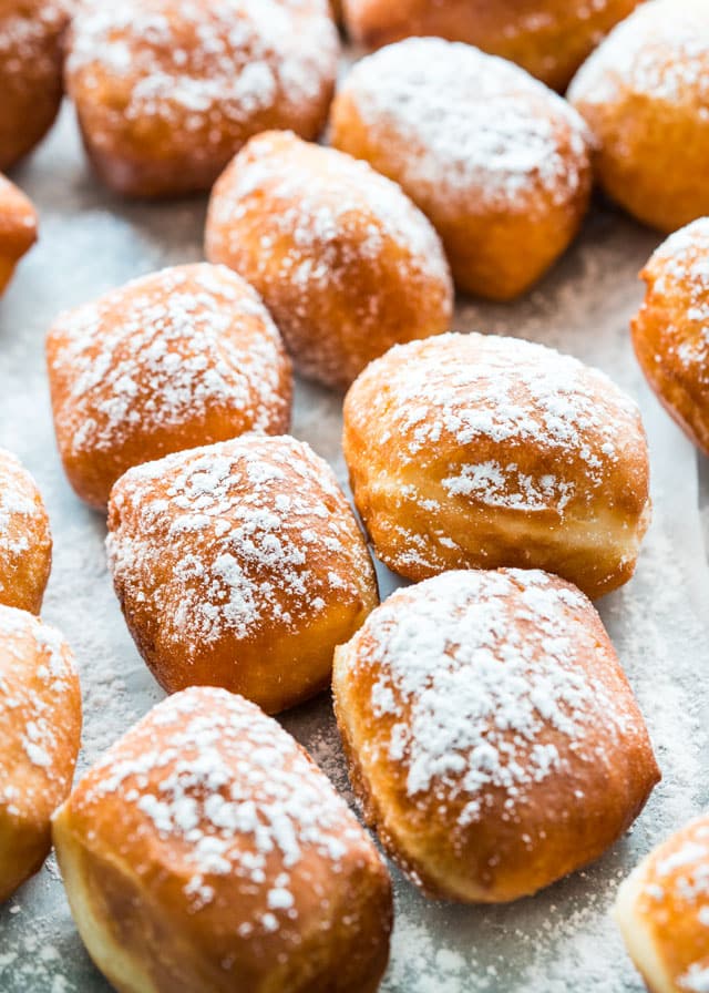closeup of beignets dusted in powdered sugar