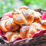 a basket full of portuguese sweet bread rolls