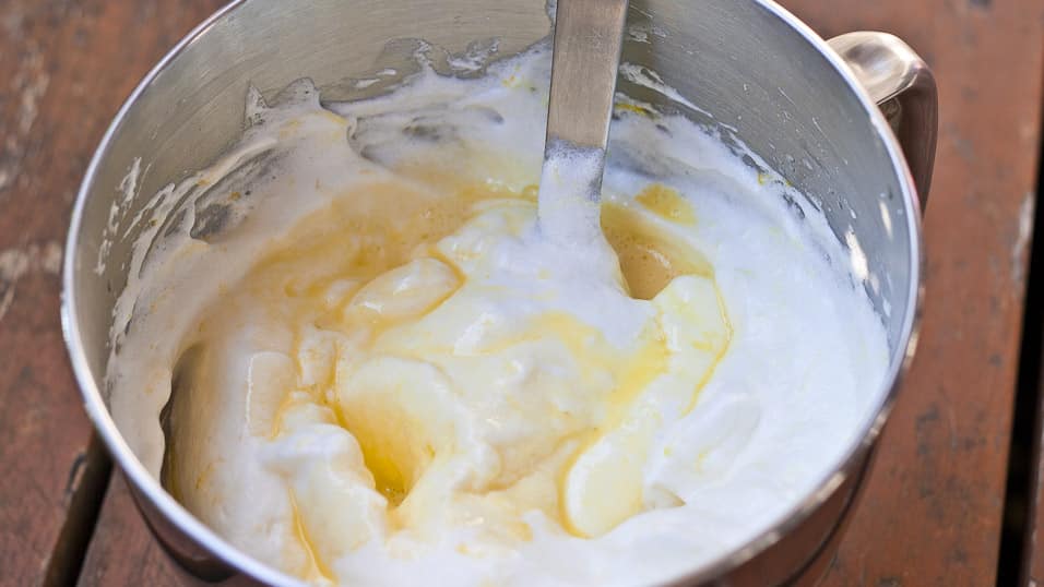 Egg yolk mixture being stired into egg whites