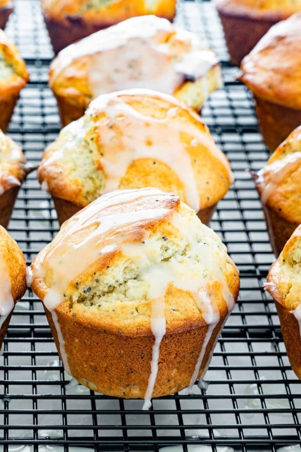 side view shot of lemon poppy seed muffins covered in a glaze