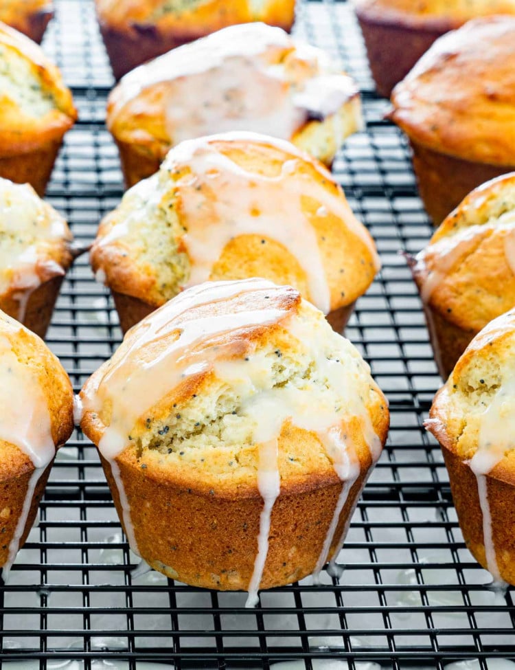 side view shot of lemon poppy seed muffins covered in a glaze