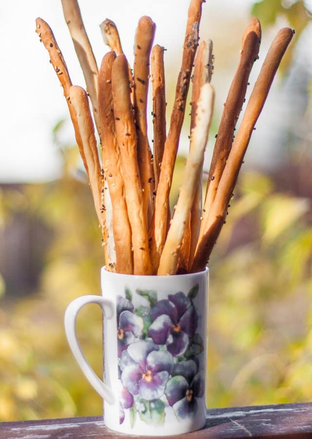 Cooked breadsticks in a flower mug