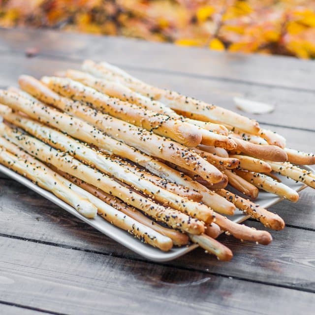 Bread sticks (Grissini) stacked on a plate