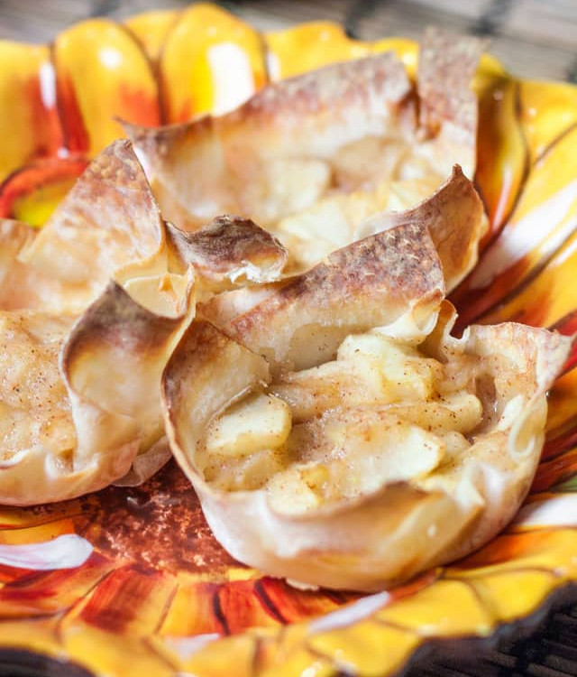 3 mini apple pies in wonton wrappers on a plate