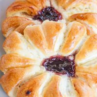 two cheese pastries with jam in the center