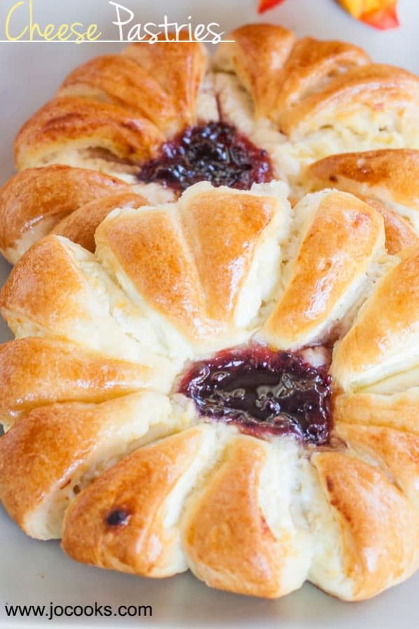 two cheese pastries with jam in the center
