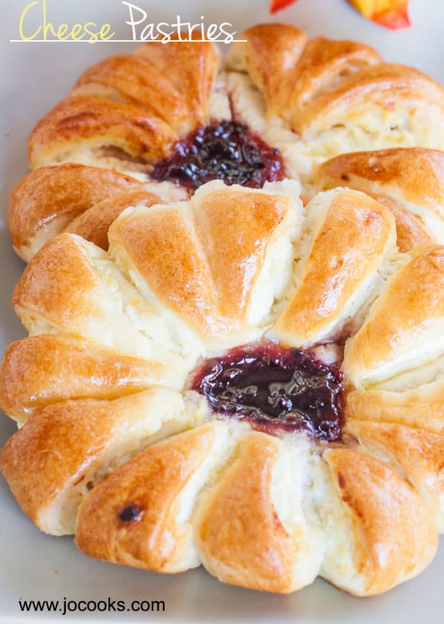 Close up shot of two Cheese Pastries with blueberry jam in the middle