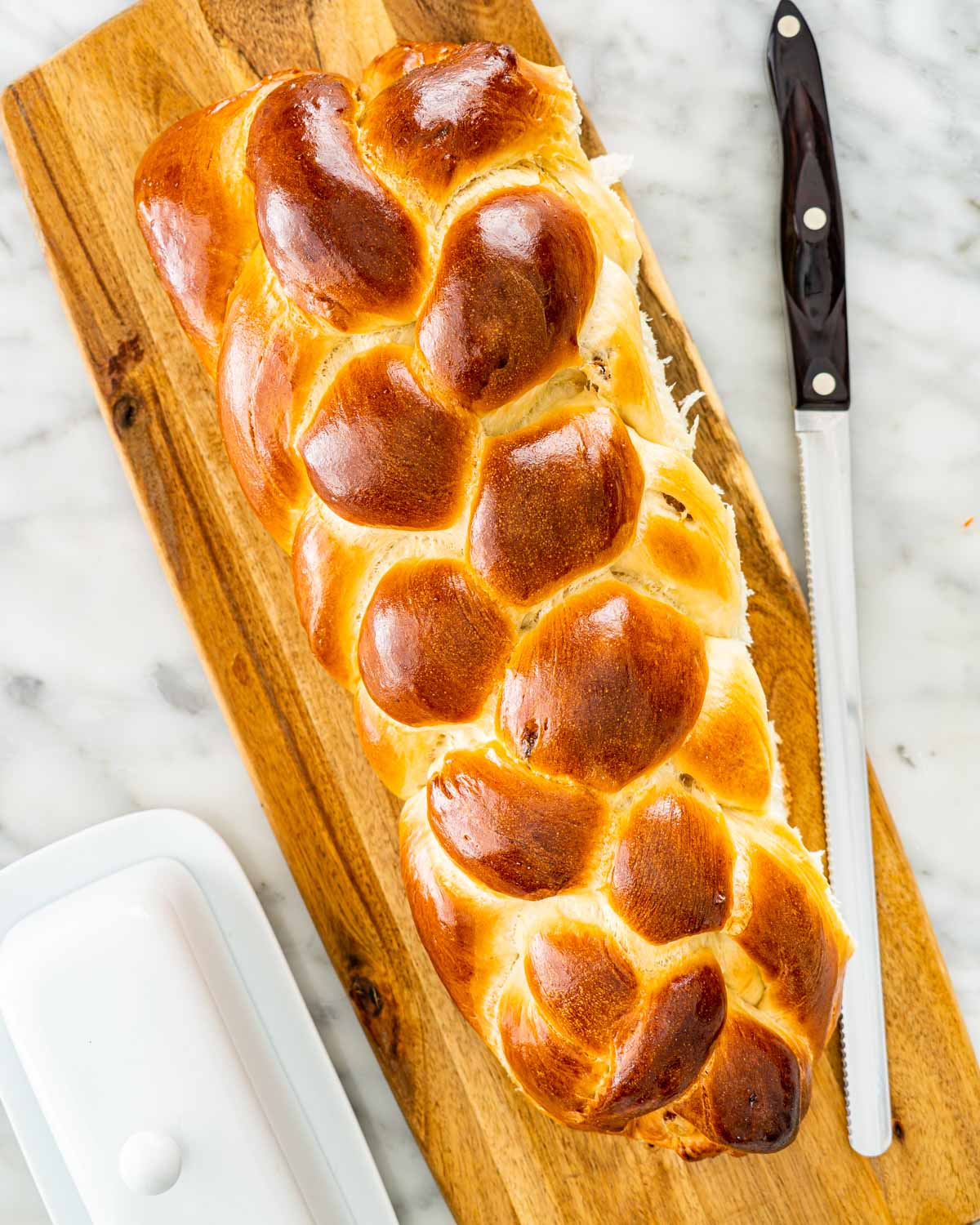 overhead shot of raisin bread on a cutting board