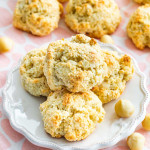 coconut macadamia cookies on a dessert plate surrounded by more cookies.