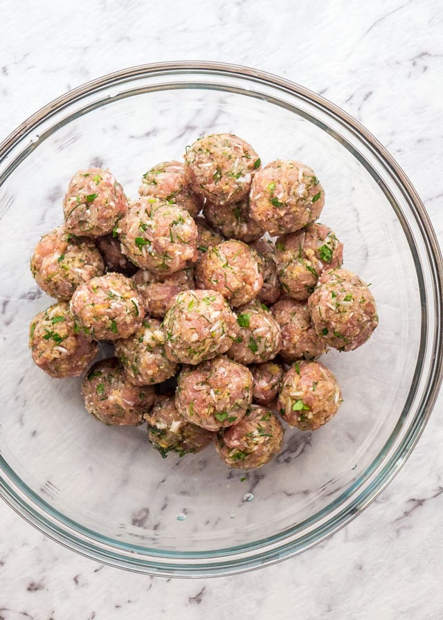 a bowl of freshly rolled meatballs