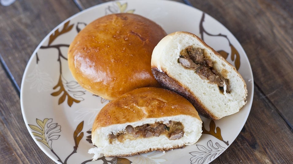 Top shot of Chinese Style Meat Buns, one cut in half