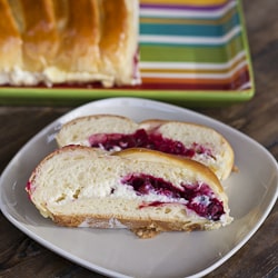 slices of cranberry and cream cheese bread on a plate
