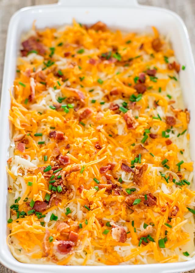 mashed potatoes with cheddar cheese and bacon ready to go in the oven