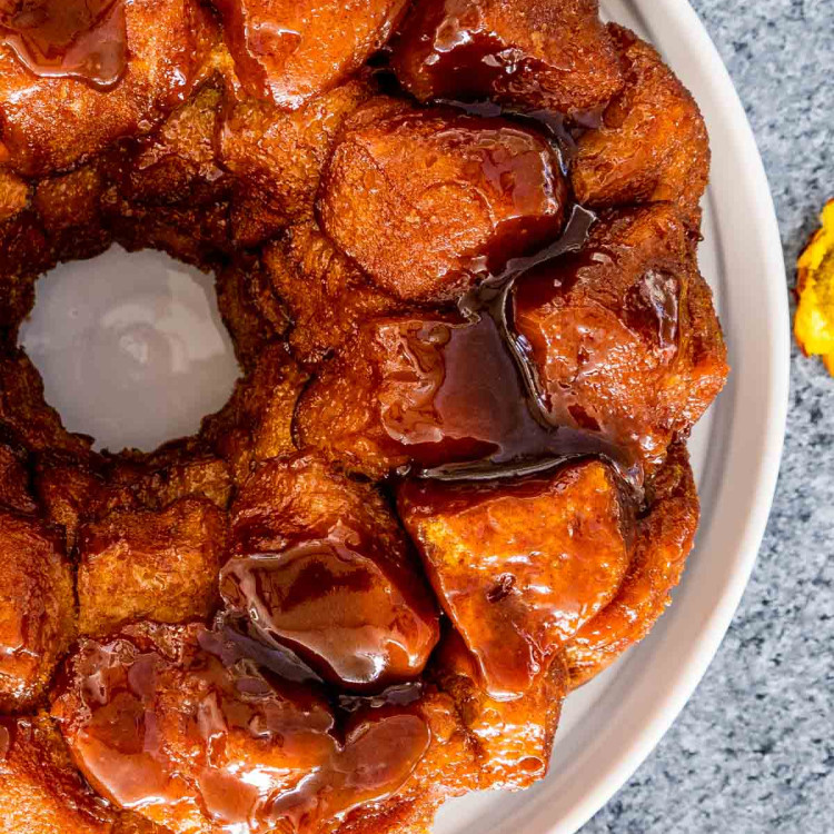 monkey bread fresh out of the oven on a white serving platter.