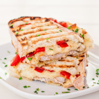 Marinated Pork Sandwich with Rosemary Aioli Mozzarella Cheese and Roasted Red Peppers