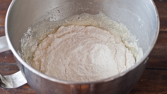 dough being prepared in a mixing bowl