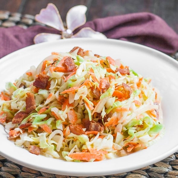 Cabbage Bacon Salad with Buttermilk Vinaigrette in a white bowl