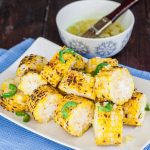 a plate full of corn with jalapeno butter