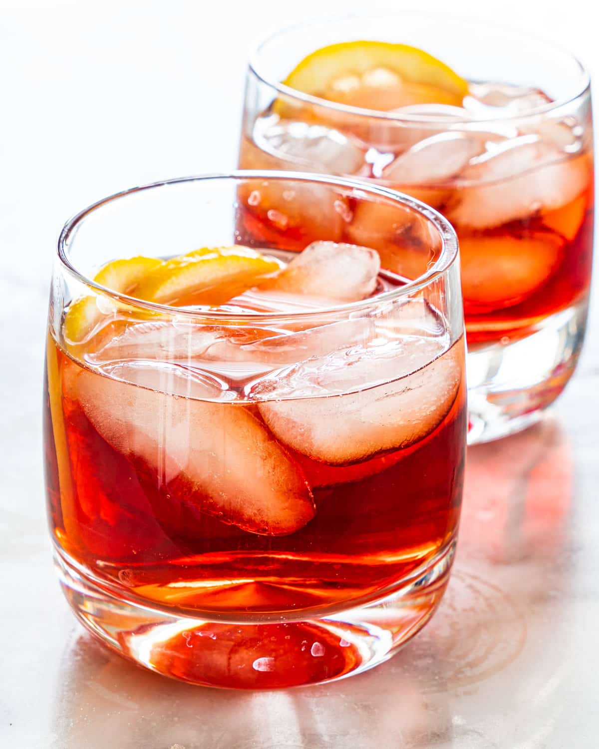 two glasses with negroni cocktails with ice