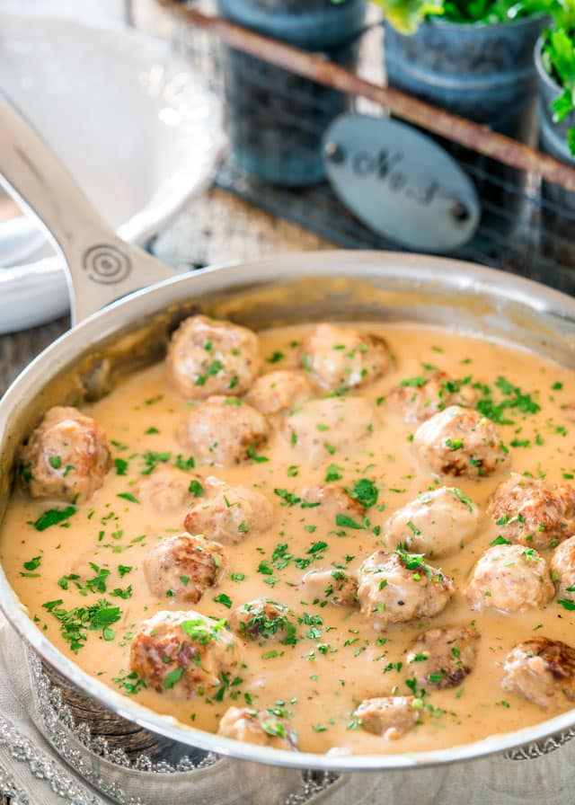 a skillet filled with swedish meatballs and gravy
