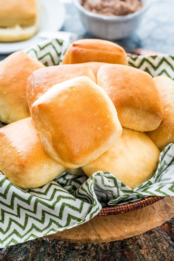 side view shot of a basket full of texas roadhouse rolls