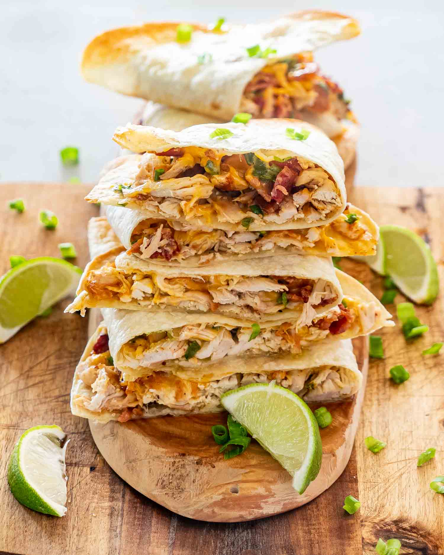 a stack of chicken quesadillas on a cutting board.