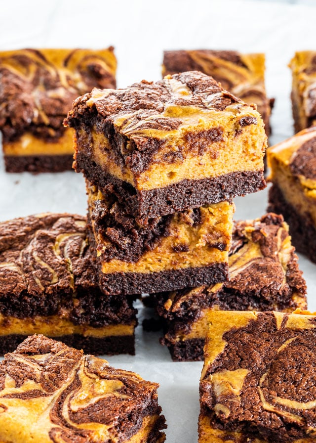 Pumpkin Cheesecake Brownies stacked on top of another