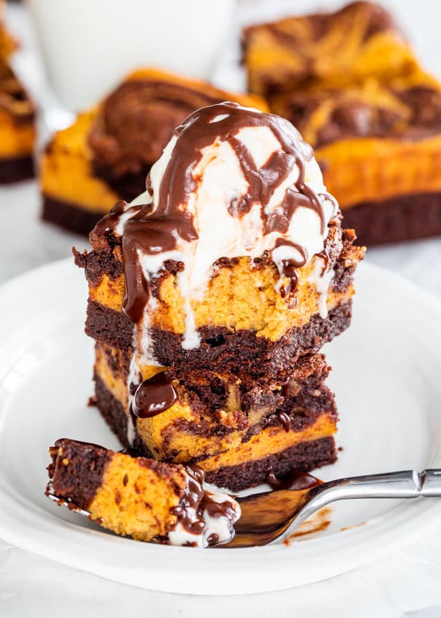 Pumpkin Cheesecake Brownies with an ice cream scoop