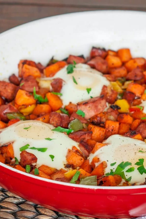 a pan full of sweet potato hash with eggs